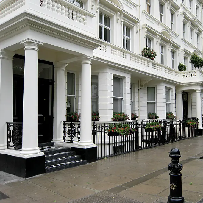 Stucco-fronted townhouses and slate mansards in Kensington and South Kensington