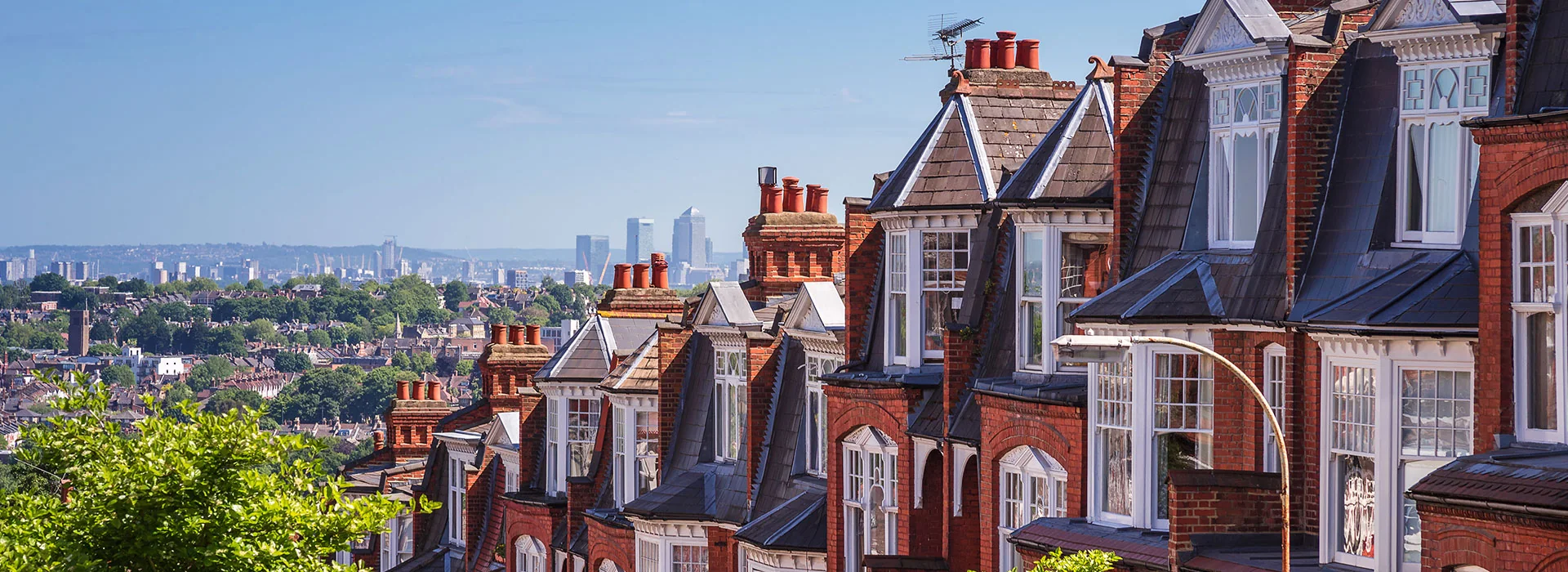 Panoramic view of Victorian brick and slate rooftops across London